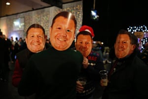 Supporters with masks of Dai Young, the Wasps director of rugby, in the fan zone.