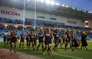 Wasps players, on a lap of honour, applaud the fans at the end of the game.
