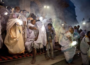 widows with sparklers at diwali looking proud and happy