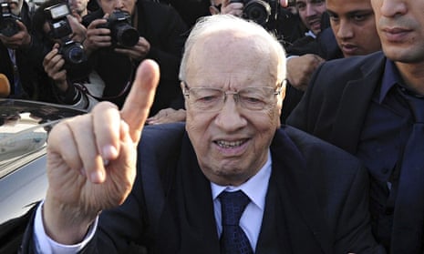Beji Caid Essebsi leaves the polling station of Soukra after casting his vote