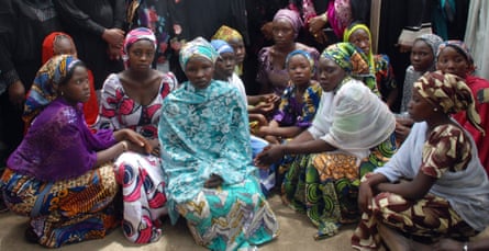 Chibok school girls who escaped from the Boko Haram fighters gather to receive information from officials.