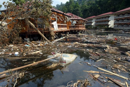 A Mercedes car submerged among debris in a pond of destroyed Khao Lak Laguna Resort by the tidal wave tsunami in Khao Lak south of Thailand. Taken on 3 Jnauary 2005