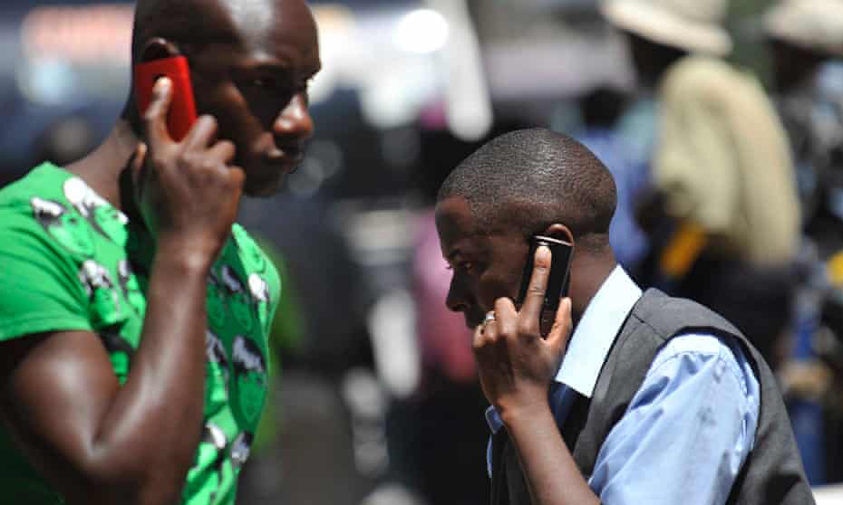 Men on their mobile phones in Kenya