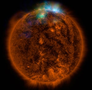 Tthe first picture of the sun taken by NuSTAR, where its data, seen in green and blue, reveals solar high-energy emission (green shows energies between 2 and 3 kiloelectron volts, and blue shows energies between 3 and 5 kiloelectron volts) coming from gas heated to above 3 million degrees