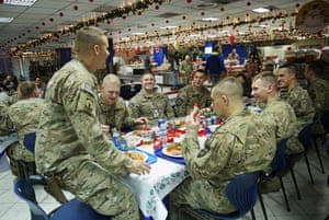 Kabul, Afghanistan NATO service members enjoy their meal during Christmas celebrations at ISAF headquarters.