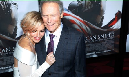 Sienna Miller is embraced by Clint Eastwood at the premiere of American Sniper