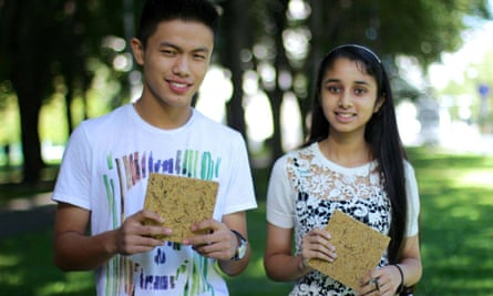 Rayvin Thingnam and Bisman Deu holding Green Wood. Made from unwanted rice waste, it can serve as a building material for low-cost housing.