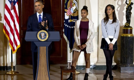 Malia, right, and Sasha Obama , centre, at the  presidential turkey pardon ceremony.