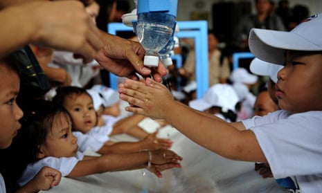 Children wash their hands ahead of Globa