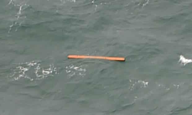This aerial view taken from an Indonesian search and rescue aircraft over the Java Sea shows floating debris spotted in the same area as other items being investigated by Indonesian authorities as possible objects from missing AirAsia flight QZ8501 on December 30, 2014.