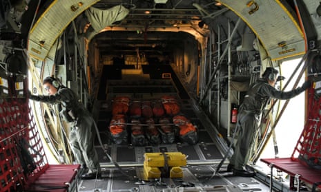 Singapore air force personnel on a C-130 aircraft take part in the search operation.