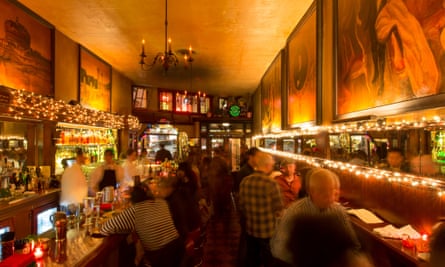 Tosca Cafe and its long, muralled bar