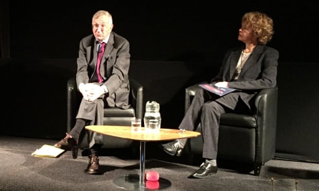 Seymour Hersh and Laura Flanders on stage at the Logan Symposium.