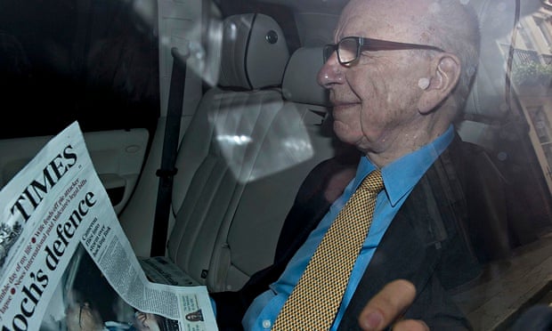 Rupert Murdoch with a copy of the Times