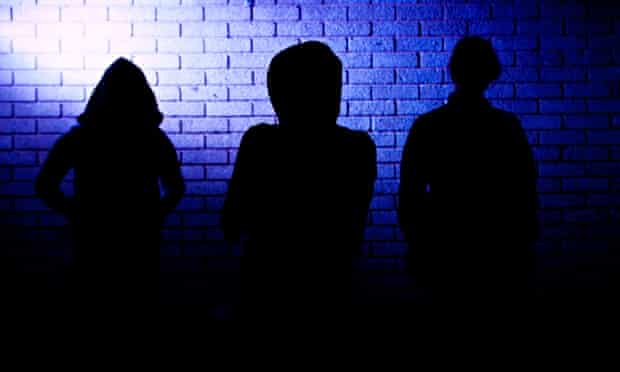 Silhouettes of three teenagers UK