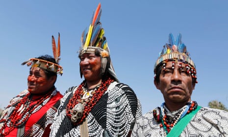 Indigenous leaders of the Shipibo people from the Peruvian Amazon at Agua Dulce beach in Lima's Chorrillos district to protest during the Cop20 talks.