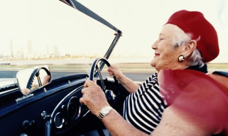 Older woman driving convertible sportscar 