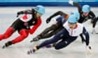 Canada's Charles Hamelin (L) and Britain's Jack Whelbourne (front R) skate during the men's 1,500 metres short track speed skating semi-finals event at the Iceberg Skating Palace during the 2014 Sochi Winter Olympics February 10, 2014.