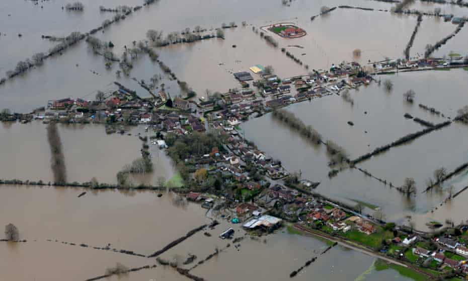 Flooded properties are seen as water surrounds the village of Moorland on the Somerset Levels on February 10, 2014 in Somerset, England