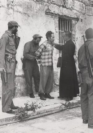 Pulitzer: Condemned former Batista army corporal Jose Rodriguez receives last rites from a priest at Matanzas, Cuba