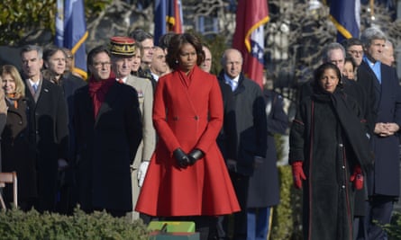Michelle Obama stands with French and US dignitaries as Barack Obama welcomes French president François Hollande, who came without a partner after a recent high-profile split,