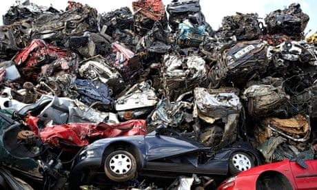 piles of crushed scrapped cars  