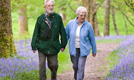 An elderly couple walking