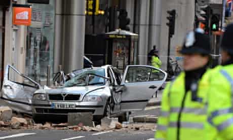 Car crushed by parts of building in central London