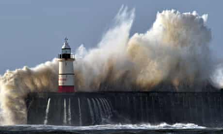 Newhaven lighthouse is battered by waves