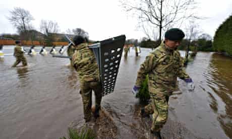 Gurkhas erect a flood barrier in Staines, Surrey 