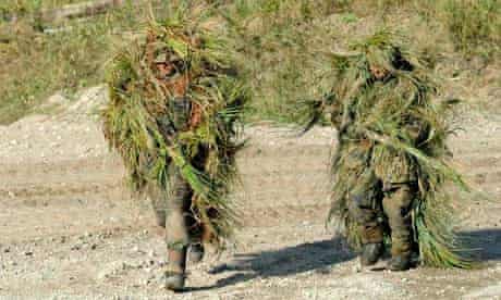 Two snipers wearing camouflage stealth camping