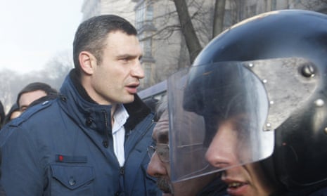 Vitali Klitschko (left) outside Ukraine's Parliament building in Kiev.