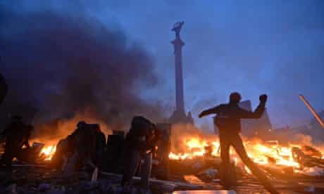 Protesters clash with police in Independence Square in Kiev