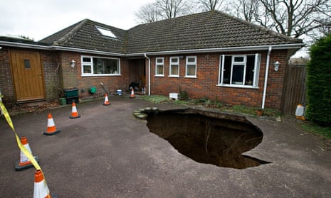 A sinkhole which swallowed a car on a driveway in High Wycombe, Buckinghamshire