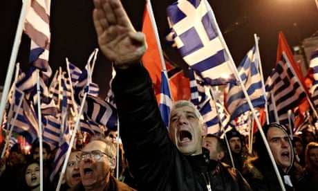 A Golden Dawn supporter raises his hand in a Nazi salute during a rally in Athens.