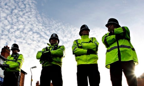 British police officers guard Jackson Road in Birmingham