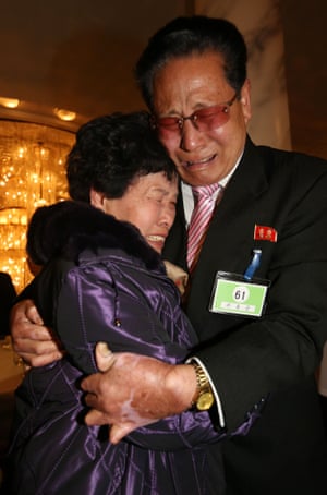 Relatives Lee Son-hyang, 88, left, of South Korea and Lee Yoon-geun, 72, of North Korea are reunited