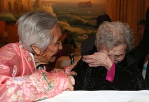 South Korean Lee Young-si, 87, cries as she is reunited with her North Korean sister Lee Jung-sil, 84