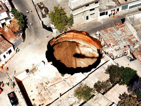 A giant sinkhole, 150 metres deep and 20 metres wide, in the neighbourhood of San Antonio in Guatemala City in February 2007, The sink hole swallowed close to twenty homes and left three people missing.