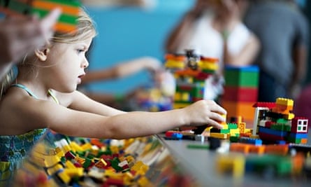 A child plays with Lego building blocks