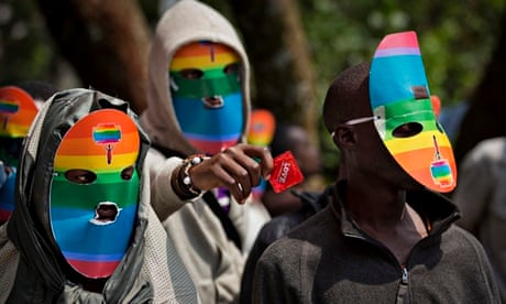 Kenyans wear masks to preserve their anonymity while staging a rare protest last month against Ugand