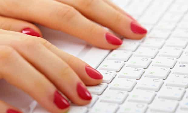 Woman's hands on a computer keyboard close up - typing