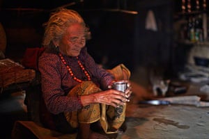 Honey hunters of Nepal: Nepalese villager preparing honey tea