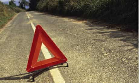 hazard warning triangle on country road