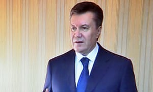 A presidential handout photograph shows Viktor Yanukovych speaking to the local TV in Kharkiv on 22 February, 2014.