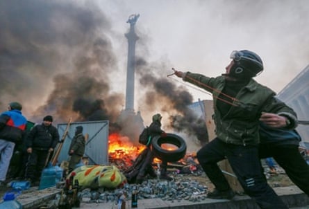 A protester uses a catapult during clashes with riot police in Kiev. According to its opponents, both internal and external, what happened in Ukraine last week was neither popular nor an insurrection.