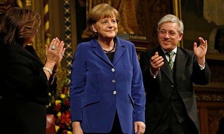 German Chancellor Angela Merkel is applauded