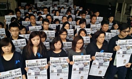 Newspaper staff wearing black in solidarity with Kevin Lau