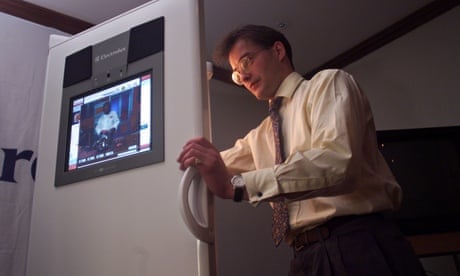 A man holding open the world's first touch-screen fridge