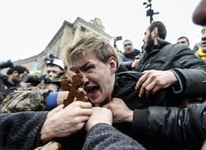 20 Photos: An alleged sniper of pro-government forces attacked by protestors in Kiev